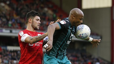 191019 - Barnsley v Swansea City - Sky Bet Championship - Andre Ayew of Swansea and Alex Mowatt of Barnsley