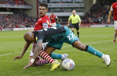 191019 - Barnsley v Swansea City - Sky Bet Championship - Andre Ayew of Swansea and Alex Mowatt of Barnsley