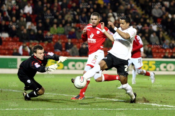 22.01.11 -Barnsley v Swansea City, Npower Championship - Barnsley's Luke Steele brings down Swansea City's Scott Sinclair to concede a penalty 