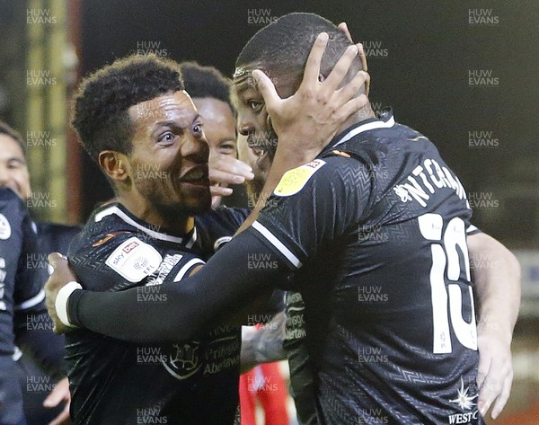 241121 - Barnsley v Swansea City - Sky Bet Championship - Olivier Ntcham of Swansea [rt] with Korey Smith of Swansea celebrate to fans