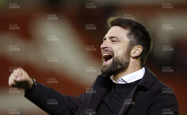 241121 - Barnsley v Swansea City - Sky Bet Championship - Head Coach Russell Martin  of Swansea celebrates with fans at the end of the match