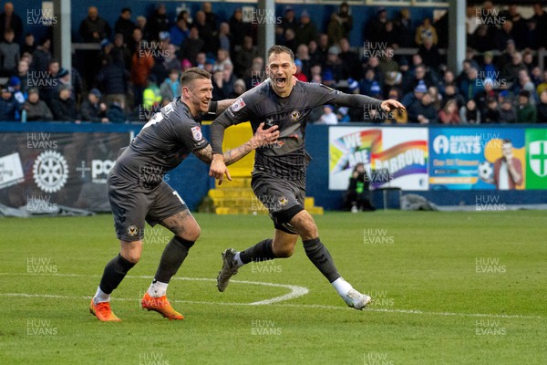 110223 - Barrow v Newport County - Sky Bet League 2 - Scot Bennett and Mickey Demetriou of Newport County celebrate Demetriou scoring a headed goal in the 95th minute to win the game 1-0