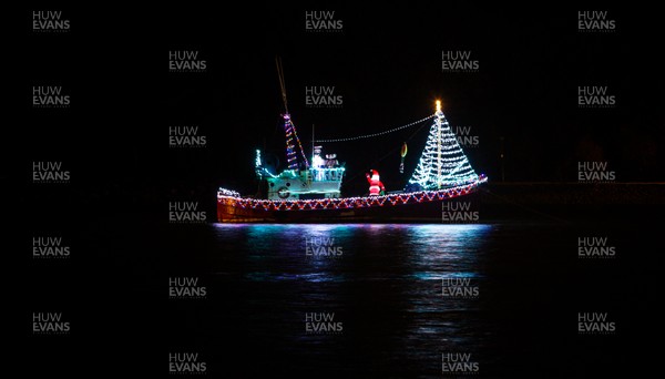 131220 - A boat in the harbour at Barry Island, South Wales, is decked out with a Santa and Christmas lights in the run up to Christmas