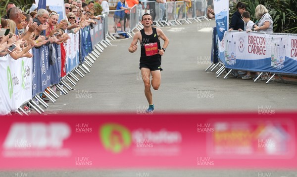 040819 - Barry Island 10k road race, Barry - Joshua Griffiths of Swansea Harriers comes home to win the race