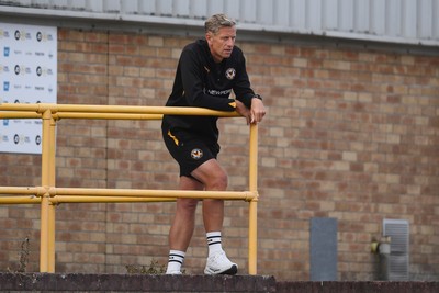 250725 - Barry Town United v Newport County - Pre Season Friendly - Newport County Manager, David Hughes watches the match from the stands