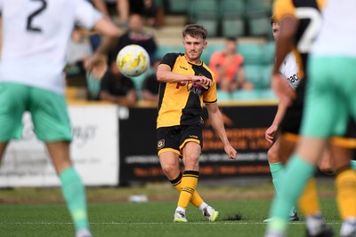 250725 - Barry Town United v Newport County - Pre Season Friendly - Ben Lloyd of Newport County has a shot at goal