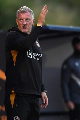 250725 - Barry Town United v Newport County - Pre Season Friendly - Newport County Assistant Manager, Wayne Hatswell leads the dugout