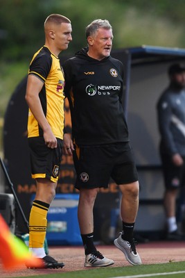 250725 - Barry Town United v Newport County - Pre Season Friendly - Newport County Assistant Manager, Wayne Hatswell leads the dugout
