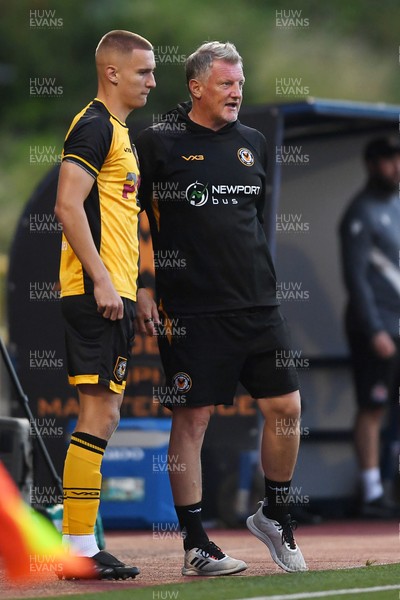 250725 - Barry Town United v Newport County - Pre Season Friendly - Newport County Assistant Manager, Wayne Hatswell leads the dugout