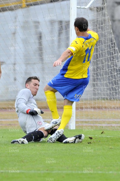 270713 - Barry Town v Cardiff City - Pre Season Friendly -    Jordan Bell of Cardiff City saves from Michael Hartley of Barry Town