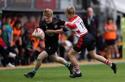 050525 - Barry v Gorseinon - U18 Plate Final - Boys U18s Finals Day - Tyler Rienholdt of Barry is tackled by Alfie Welsby of Gorseinon 