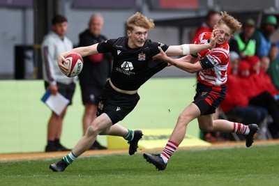 050525 - Barry v Gorseinon - U18 Plate Final - Boys U18s Finals Day - Tyler Rienholdt of Barry is tackled by Alfie Welsby of Gorseinon 