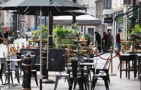 260421 Bars and restaurants reopen, Wales - Bars and restaurants in Cardiff city centre prepare to welcome guests as Welsh Government COVID-19 restrictions are lifted allowing customers to be served outdoors
