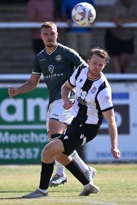 250726 - Bath City v Newport County - Pre Season Friendly - Cole Jarvis of Newport County is challenged by Alex Fisher of Bath City