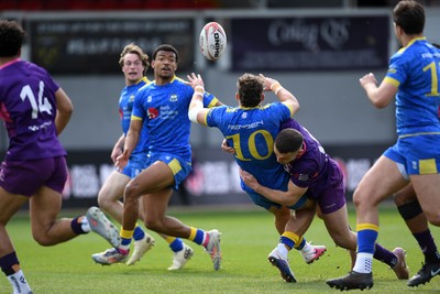 220426 - Bath v Loughborough - Men's BUCS Final - Will Roue of Bath passes to Tyler Offiah of Bath whilst being tackled by Ben Taylor of Loughborough