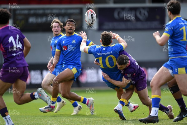 220426 - Bath v Loughborough - Men's BUCS Final - Will Roue of Bath passes to Tyler Offiah of Bath whilst being tackled by Ben Taylor of Loughborough