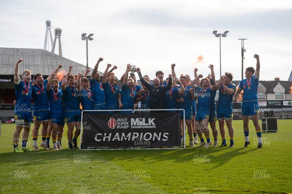 220426 - Bath v Loughborough - Men's BUCS Final - Bath players celebrate lifting the trophy and winning the trebble