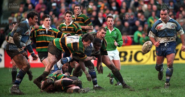 250295 - Bath v Northampton - Pilkington Cup Quarter Final - Steve Ojomoh of Bath (on floor) realises the ball under pressure from Justin Cassell (7) 