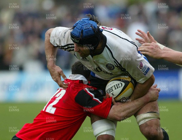 260403 - Bath v Saracens - Parker Pen Challenge Cup Semi Final Second Leg - Bath Captain Danny Grewcock gets tackled by Kevin Sorrell