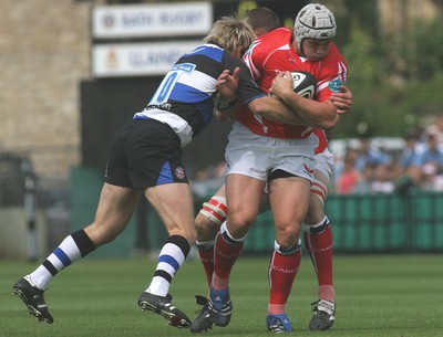 23.08.08 Bath Rugby vs. Llanelli Scarlets. Pre-season Friendly, The Recreation Ground, Bath.  Scarlets Jonathan Davies is tackled by Shaun Berne.  