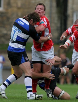 23.08.08 Bath Rugby vs. Llanelli Scarlets. Pre-season Friendly, The Recreation Ground, Bath.  Scarlets Matthew Rees is tackled by Michael Lipman(7) as Justin Harrison hangs on in the tackle.  