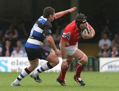 23.08.08 Bath Rugby vs. Llanelli Scarlets. Pre-season Friendly, The Recreation Ground, Bath. Scarlets David Lyons tries to escape the tackle of Jack Cuthbert. 