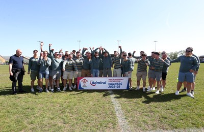 250426 - Beddau Athletic, Admiral National League 6 East Central - Captains Chris Bird and Luke Jones lift the trophy alongside team mates