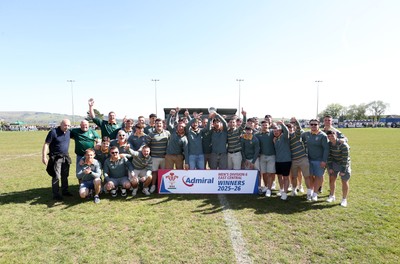 250426 - Beddau Athletic, Admiral National League 6 East Central - Captains Chris Bird and Luke Jones lift the trophy alongside team mates