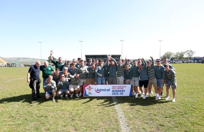 250426 - Beddau Athletic, Admiral National League 6 East Central - Captains Chris Bird and Luke Jones lift the trophy alongside team mates