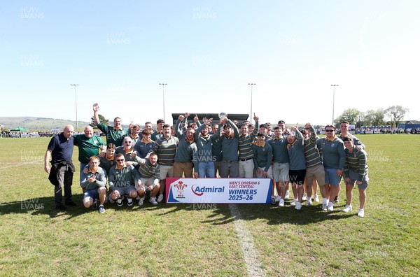 250426 - Beddau Athletic, Admiral National League 6 East Central - Captains Chris Bird and Luke Jones lift the trophy alongside team mates