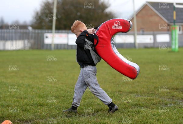 091119 - Beddau v Carmarthen Quins - Specsavers Cup - Local boy carries a pad across the pitch