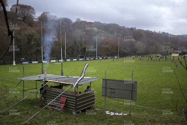 161119 - Bedlinog RFC v Senghenydd RFC - WRU Specsavers Plate - Picture shows a group of spectators watching the game with two wood burning fires in their shelter