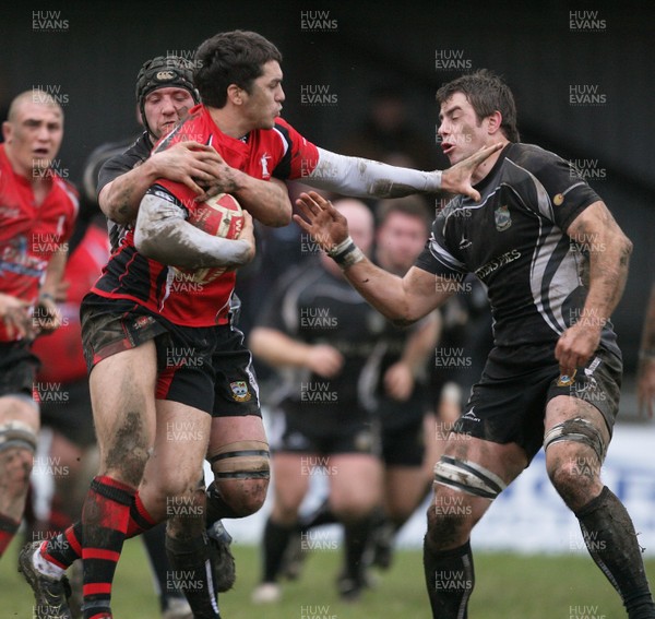 15.01.11 Bedwas v Aberavon... Aberavon's Liam Gadd is tackled by Rob Carter. 