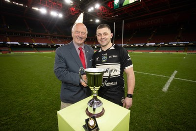120426 - Bedwas v Bridgend Athletic - Mens Championship Cup Final - Captain Dale Rogers is presented the trophy by WRU president Terry Cobner