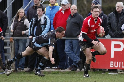 27.03.10 Bedwas RFC v Cardiff RFC - Swalec Cup 1/4 final - Bedwas' Mathew Pizey tries to outpace Cardiff's James Loxton. 