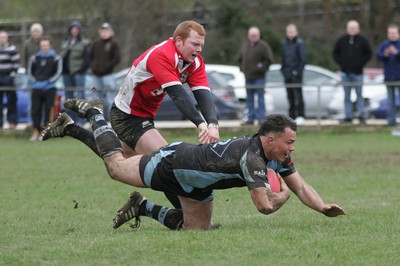 27.03.10 Bedwas RFC v Cardiff RFC - Swalec Cup 1/4 final - Cardiff's Darren Ryan dives over to score a try despite pressure from Bedwas' Tom Edwards.  