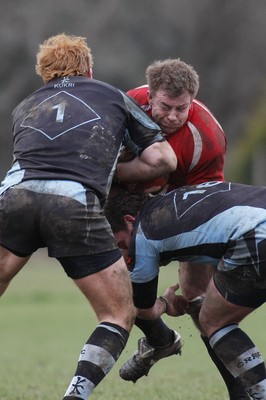 27.03.10 Bedwas RFC v Cardiff RFC - Swalec Cup 1/4 final - Bedwas' Deri Mathews is tackled by Cardiff's Ian George(1) & Gary Horrigan.  