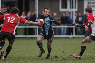 27.03.10 Bedwas RFC v Cardiff RFC - Swalec Cup 1/4 final - Cardiff's Gareth Davies steps inside Nathan Williams(12) as Adam Greendale closes down. 