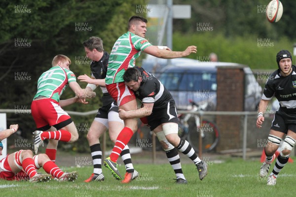 270413 - Bedwas v Llandovery - Welsh Premiership - Llandovery's Phil Day offloads the ball as he is tackled 