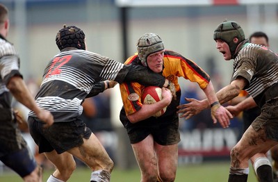 080203 - Bedwas v Newport - Principality Cup - Newport's Rhys Jones is caught by Andrew Harrison (left) and Chris Brown (rt)