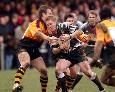 080203 - Bedwas v Newport - Principality Cup - Bedwas' Mike Price takes hit from Jason Jones Hughes