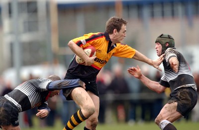 080203 - Bedwas v Newport - Principality Cup - Newport's Jason Jones Hughes is caught by Chris Brown (rt) and Nathan Hill (left)