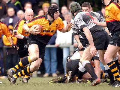 080203 - Bedwas v Newport - Principality Cup - Newport's Ian Gough runs at Bedwas' Chris Brown