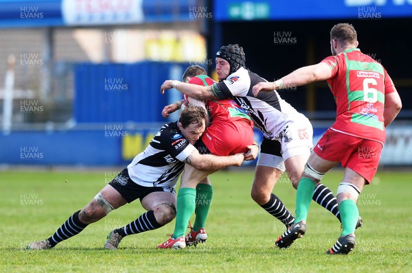 090416 Bedwas v Pontypridd - Fosters Cup Final Rhys Shellard of Pontypridd tackles James Dixon of Bedwas