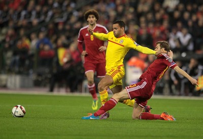 161114 - Belgium v Wales - European Championship Qualifier - Hal Robson-Kanu of Wales is tackled by Nicolas Lombaerts of Belgium 