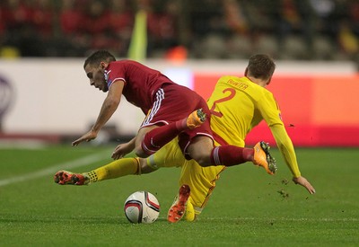 161114 - Belgium v Wales - European Championship Qualifier - Eden Hazard of Belgium is tackled by Chris Gunter of Wales 