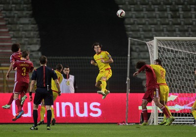 161114 - Belgium v Wales - European Championship Qualifier - Gareth Bale of Wales headers the ball away from their goal