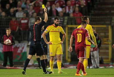161114 - Belgium v Wales - European Championship Qualifier - Joe Ledley of Wales is shown a yellow card