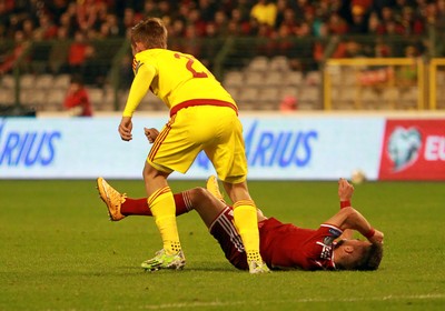 161114 - Belgium v Wales - European Championship Qualifier - Dries Mertens of Belgium goes down injured after colliding with Chris Gunter of Wales 