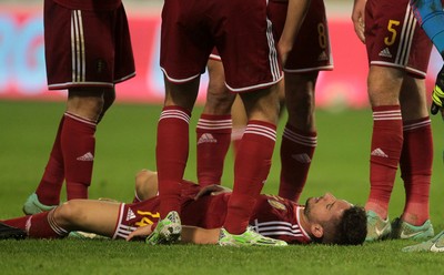 161114 - Belgium v Wales - European Championship Qualifier - Dries Mertens of Belgium goes down injured after colliding with Chris Gunter of Wales 